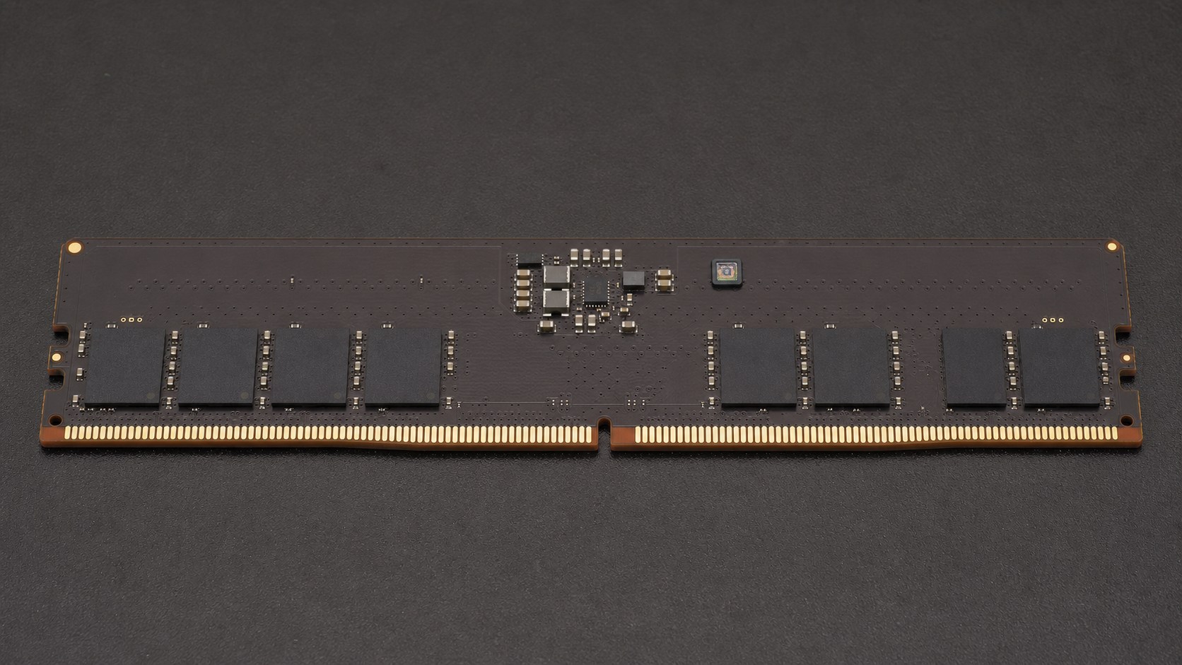 DDR5 construction reference illustrating dm3m's three silicon roles; final package placement is not shown